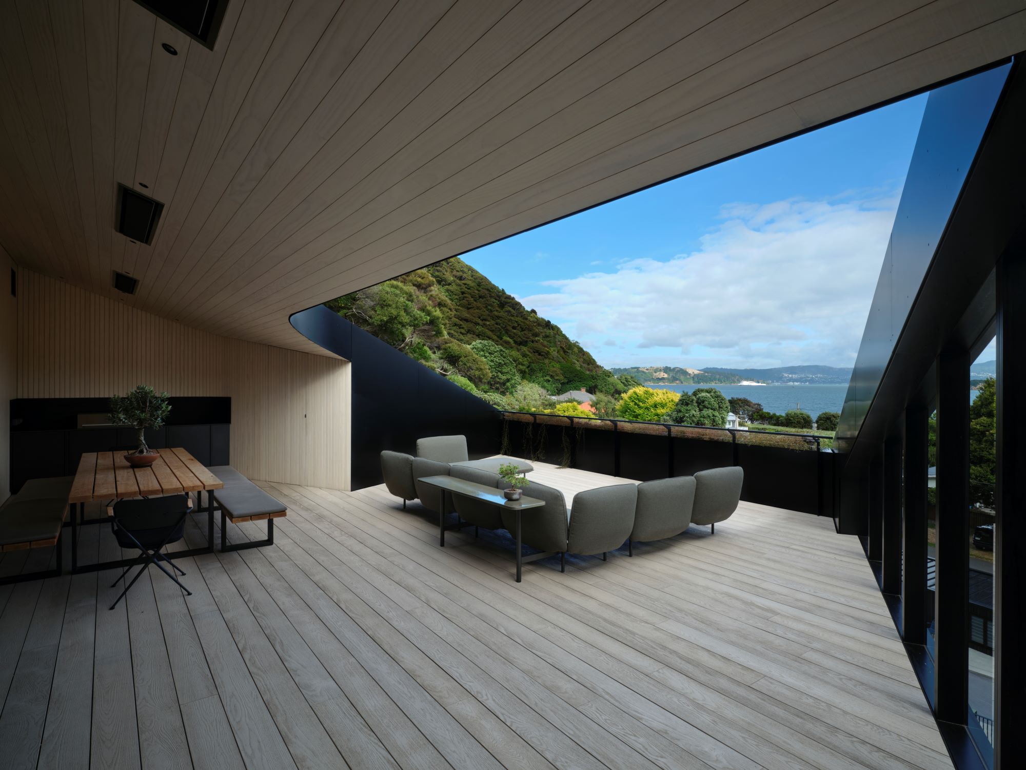 Eastbourne House - Upper floor deck with curved roof edge